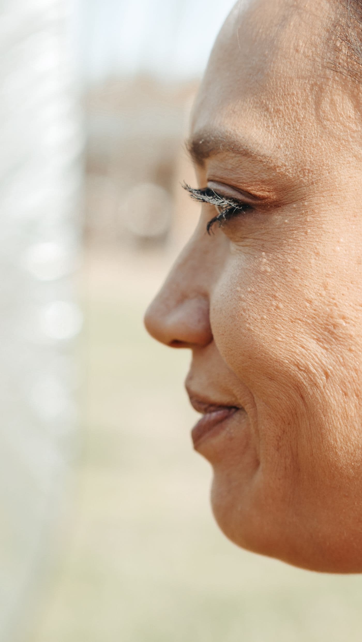 Profile portrait showing cheek and jawline in soft daylight